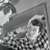 Rock Hudson checking himself out in a mirror photo, 1950s