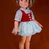 Shirley Temple Ideal vinyl 17 inch doll with velvet vest and flowered dress, 1972