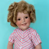 Shirley Temple Danbury Mint porcelain doll wearing Curly Top outfit