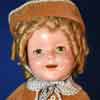 Shirley Temple doll wearing Poor Little Rich Girl coat ensemble