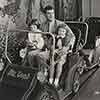 Tony Curtis with daughter Kelly and Claire Wilcox on Disneyland Mr. Toad's Wild Ride attraction, 1962, during filming of Forty Pounds of Trouble