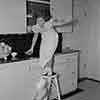 Shirley Temple dropping dishes at home, 1937