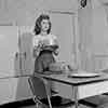 Shirley Temple at home baking a cake, 1943