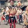 Disneyland Jester on unicycle outside of Merlin's Magic Shoppe, 1965