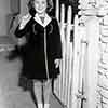 Shirley Temple receiving her Rose Parade Grand Marshal ribbon at her Fox Bungalow, November 21, 1938